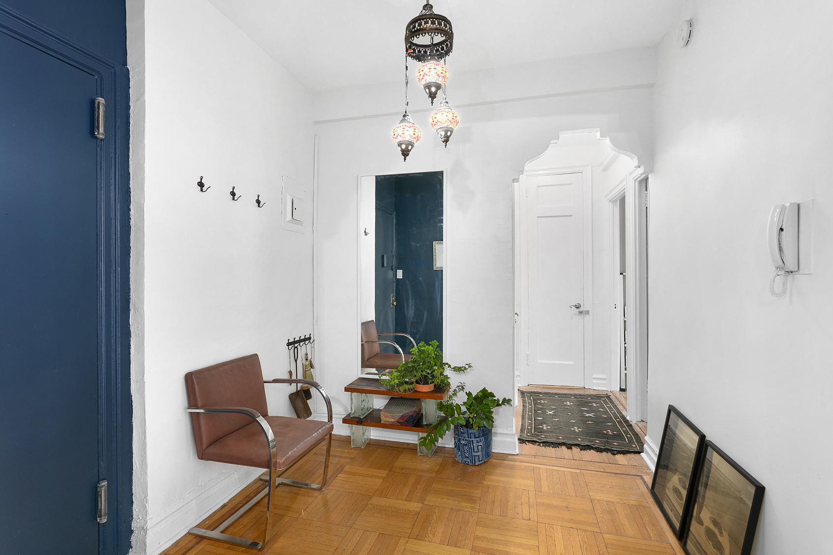 70 Lenox Road, Unit C4 Brooklyn, NY 11226 - Photo 4 of 7 a living room with furniture and a chandelier