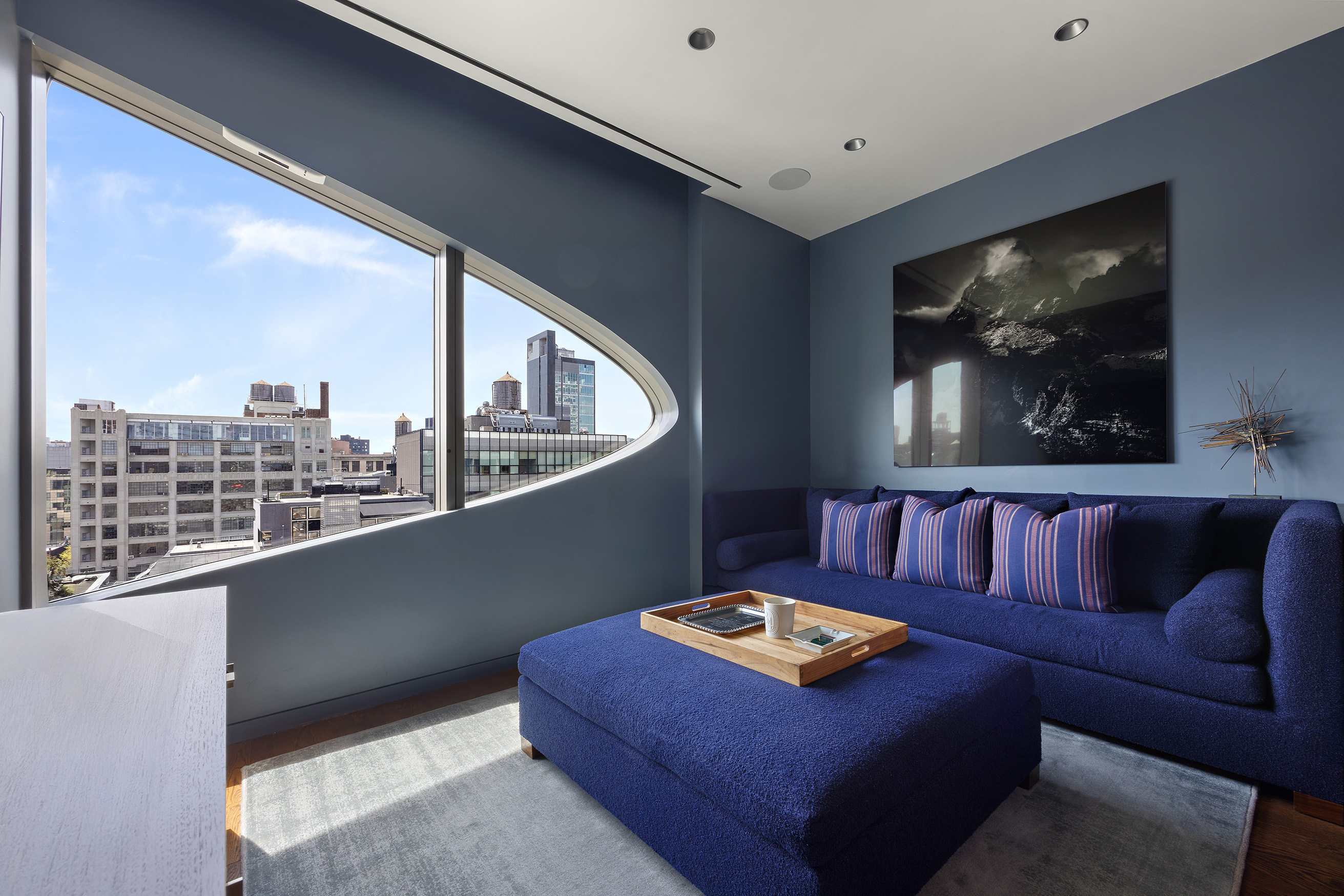 520 West 28th Street, Unit PH37 Manhattan, NY 10001 - Photo 11 of 45 a living room with furniture and a flat screen tv