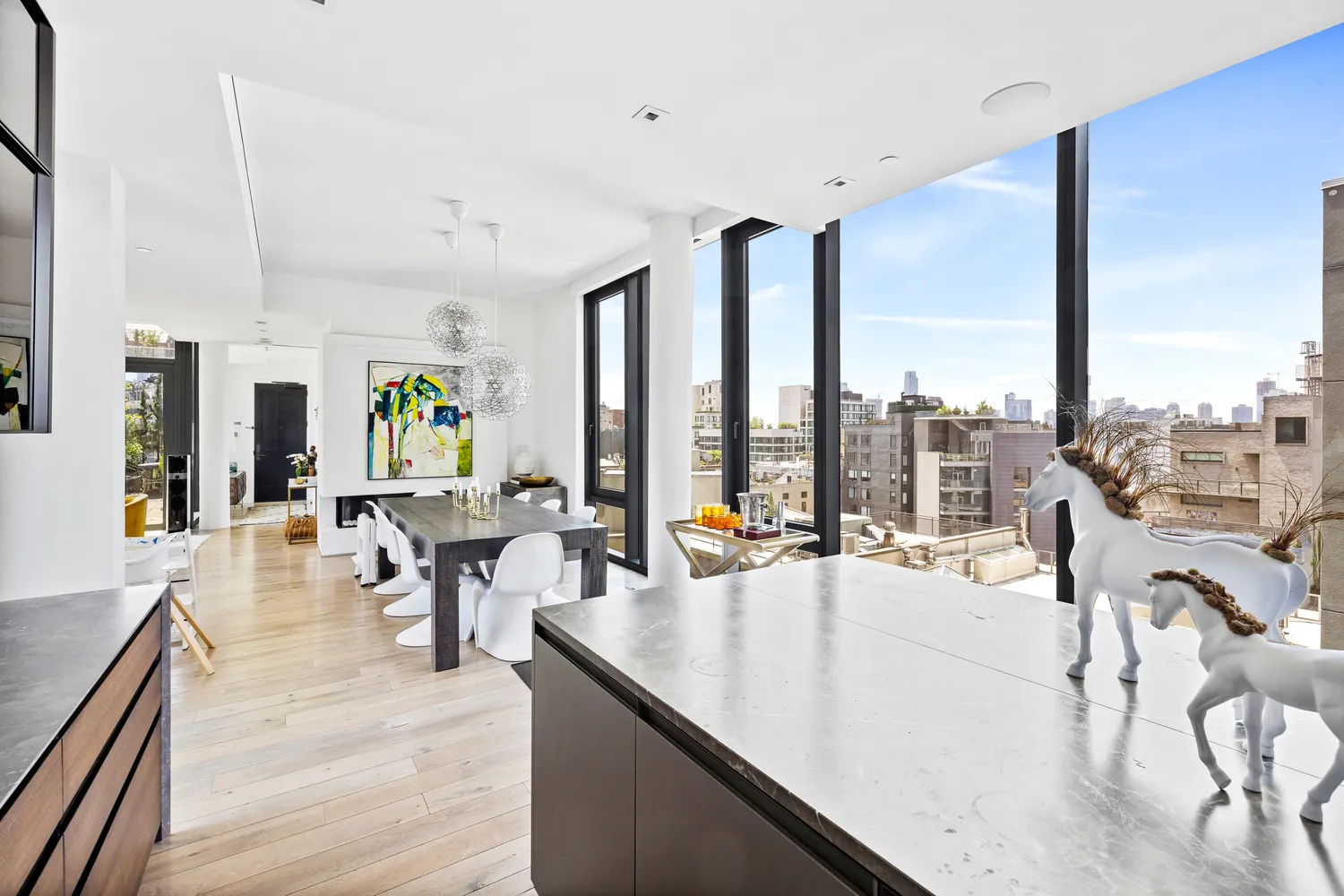 a very nice looking living room with a large window and furniture