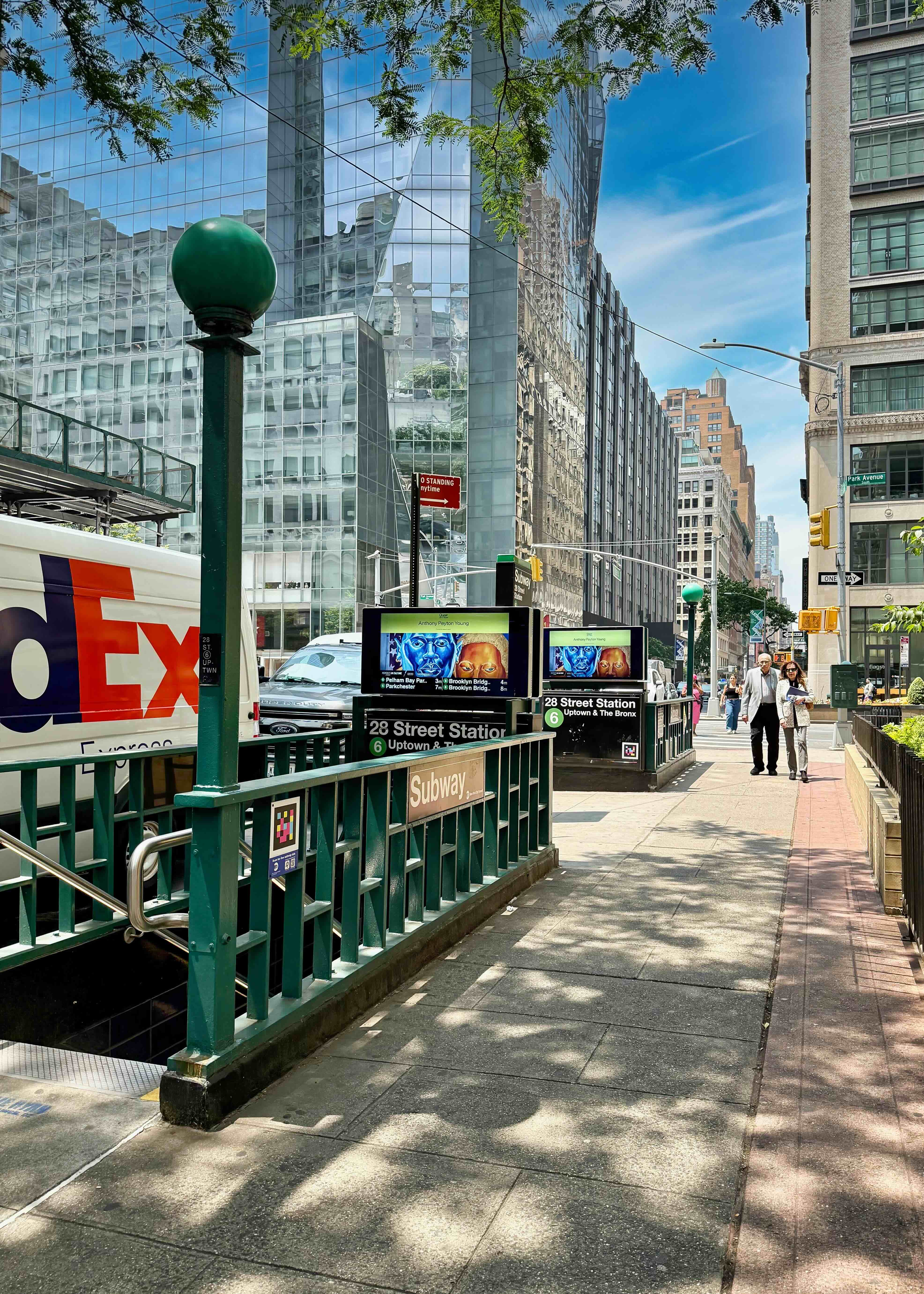 229 East 29th Street, Unit 5H Manhattan, NY 10016 - Photo 13 of 15 a street with lots of traffic and tall trees