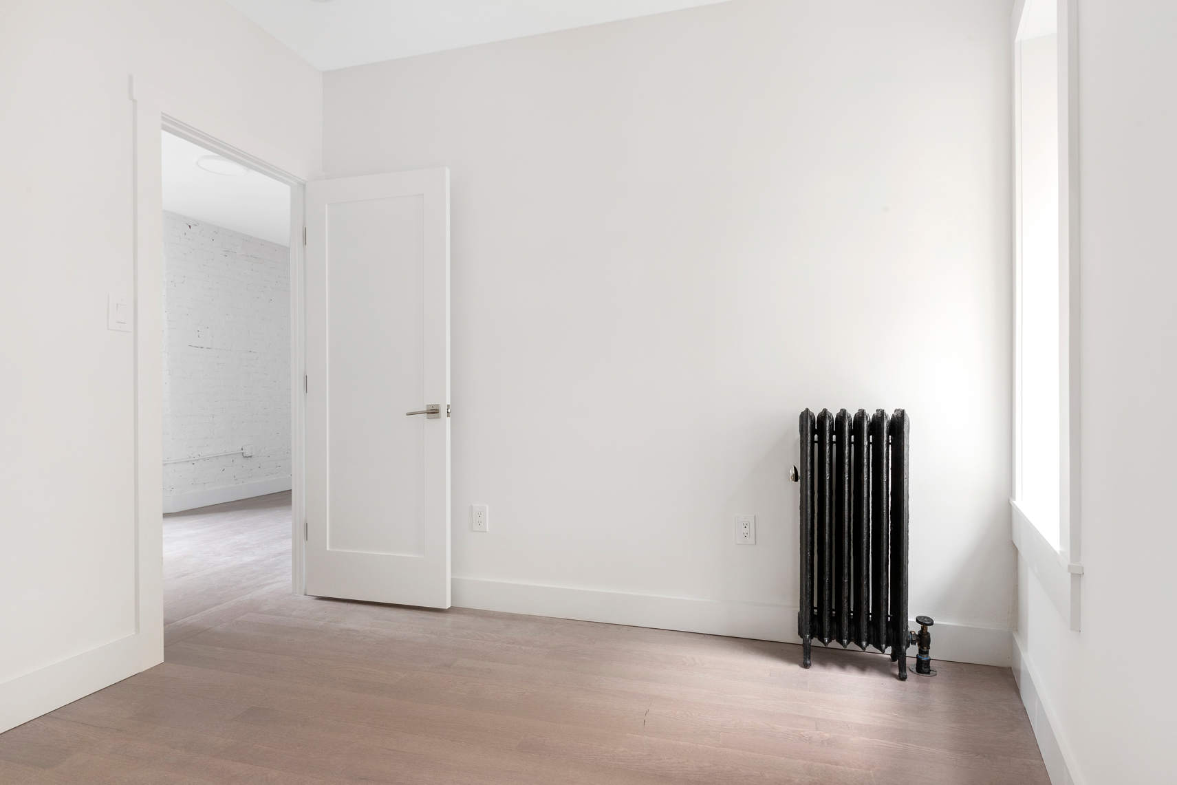 1392 Madison Avenue, Unit 24 Manhattan, NY 10128 - Photo 4 of 6 a view of an empty room