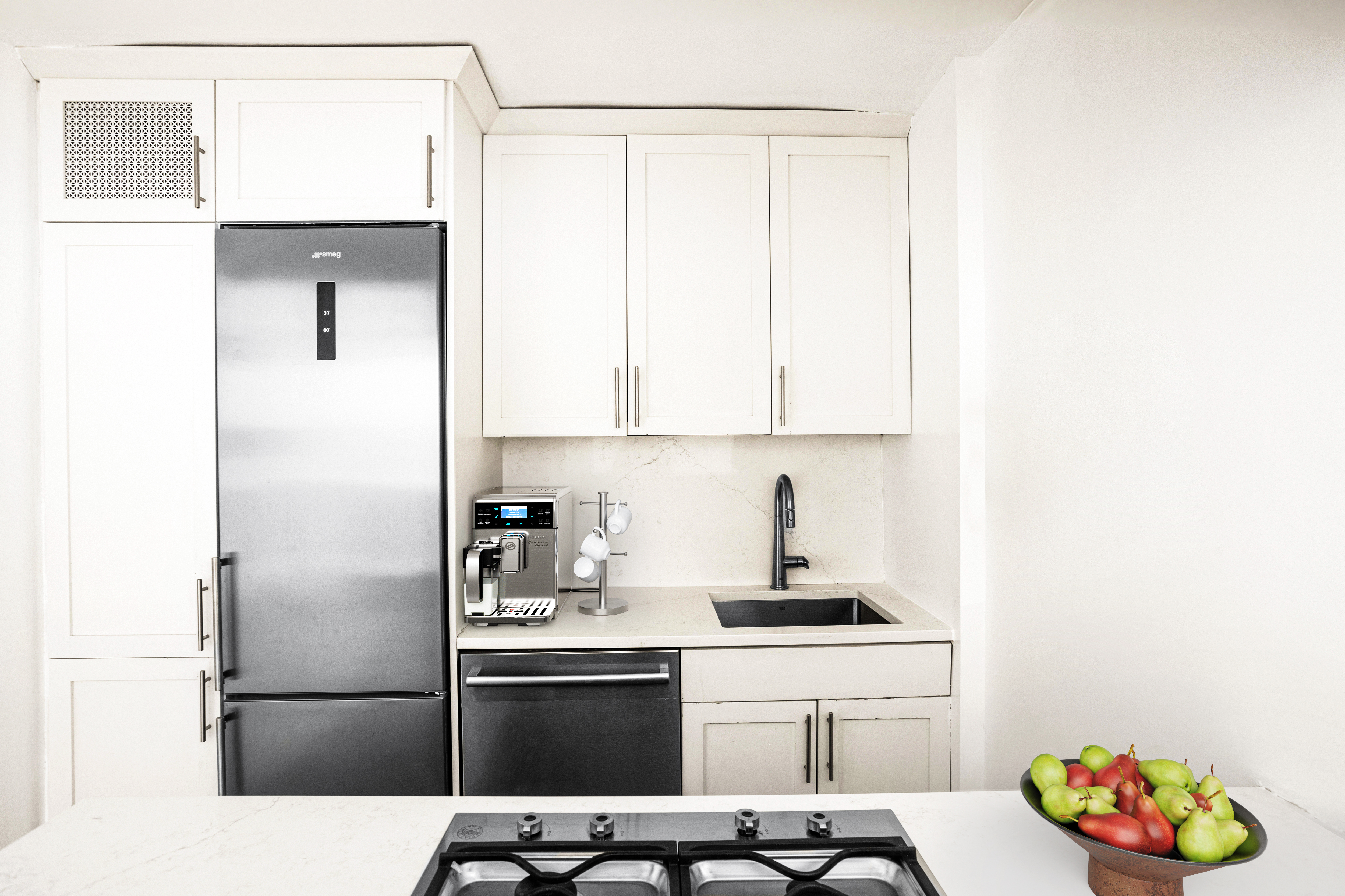 140 7th Avenue, Unit 7M Manhattan, NY 10011 - Photo 5 of 11 a kitchen with a sink and a refrigerator