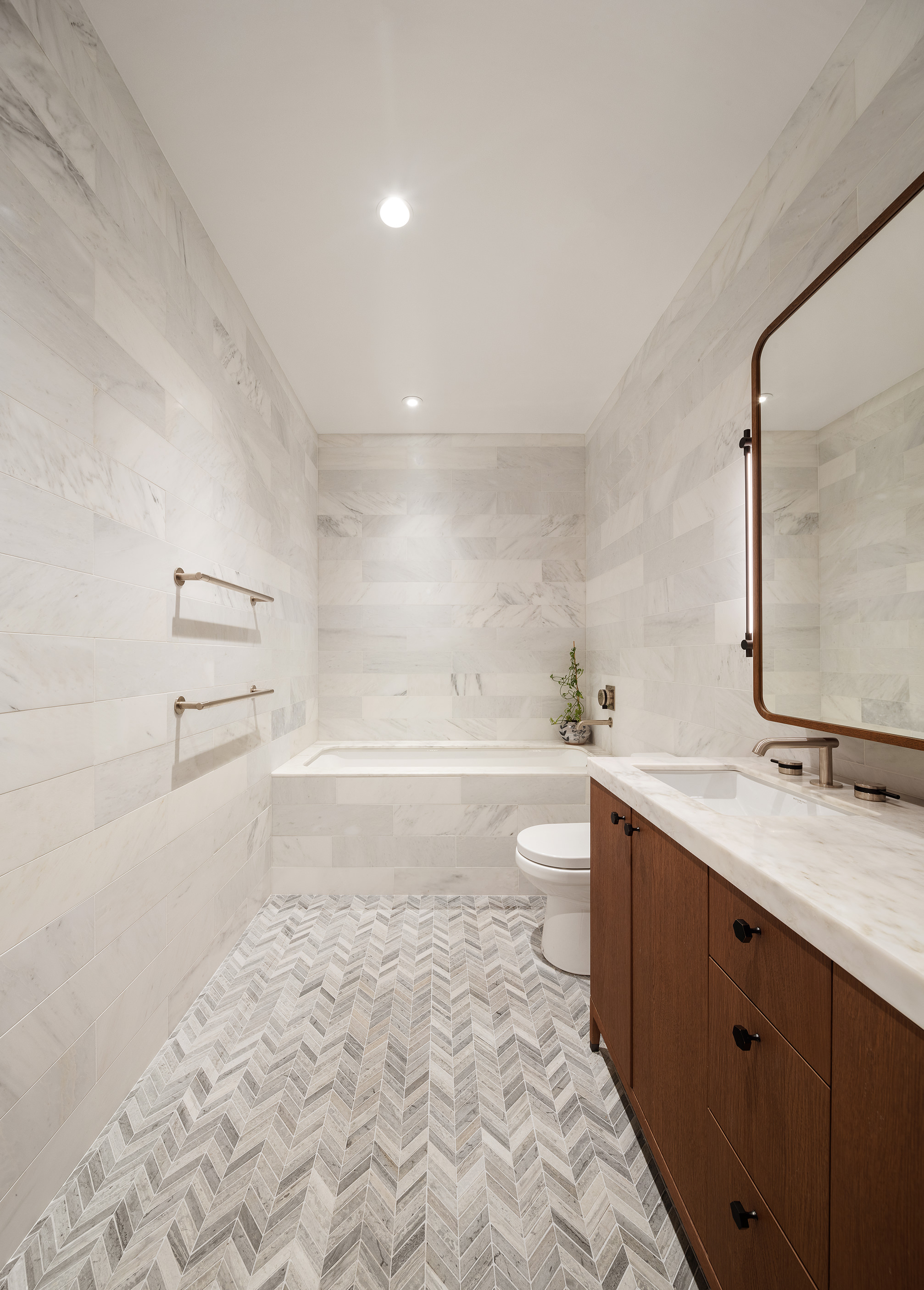 115 York Street, Unit 17A Brooklyn, NY 11201 - Photo 9 of 12 a bathroom with a sink a toilet and mirror