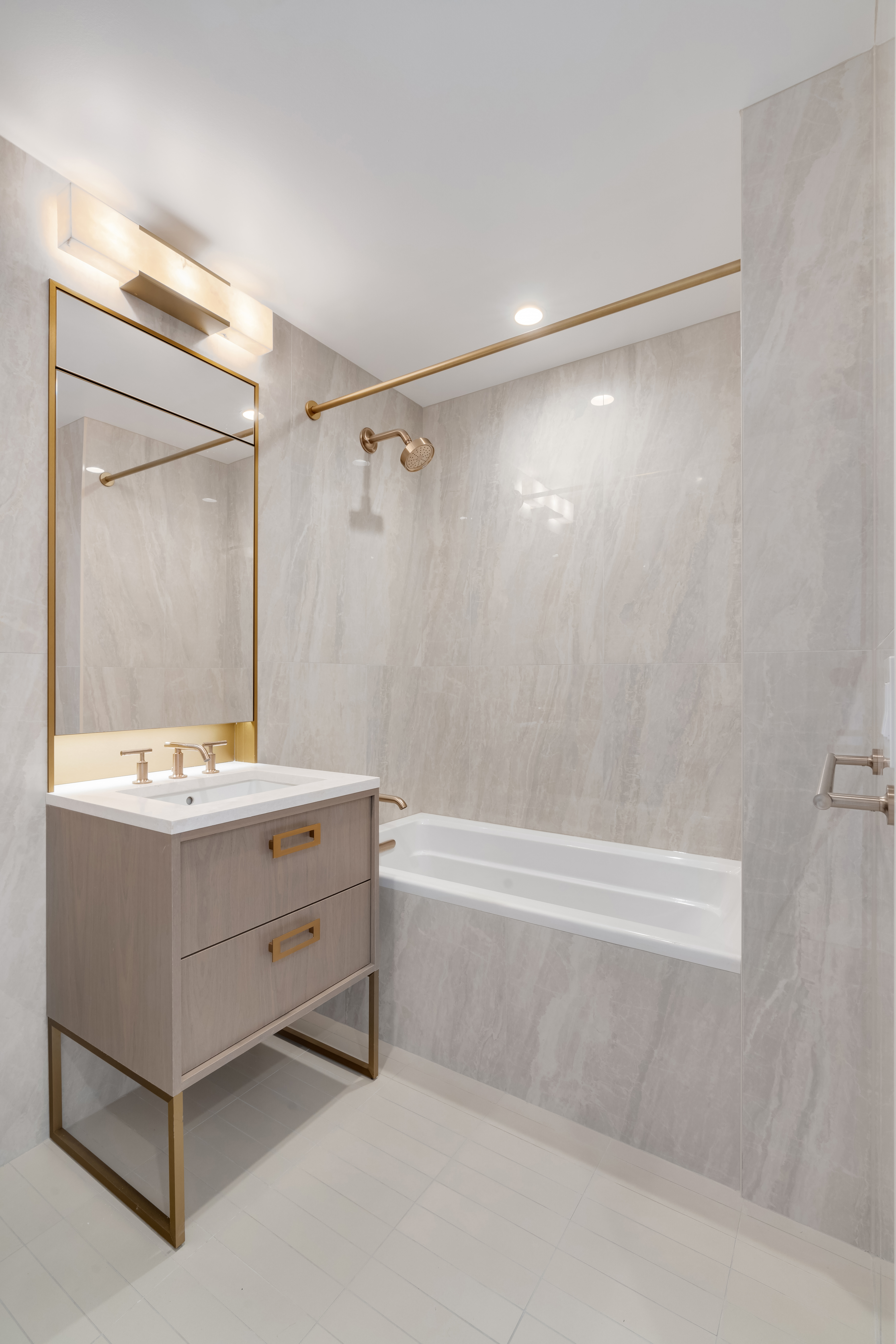 45-3 Court Square, Unit 507 Queens, NY 11101 - Photo 3 of 7 a bathroom with a tub sink and mirror