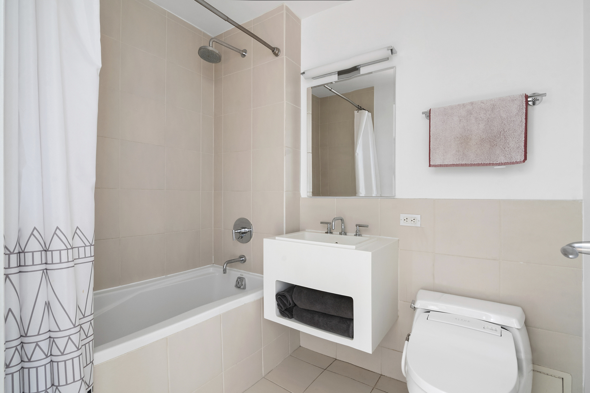 87 Smith Street, Unit 8B Brooklyn, NY 11201 - Photo 6 of 8 a bathroom with a sink a toilet and shower