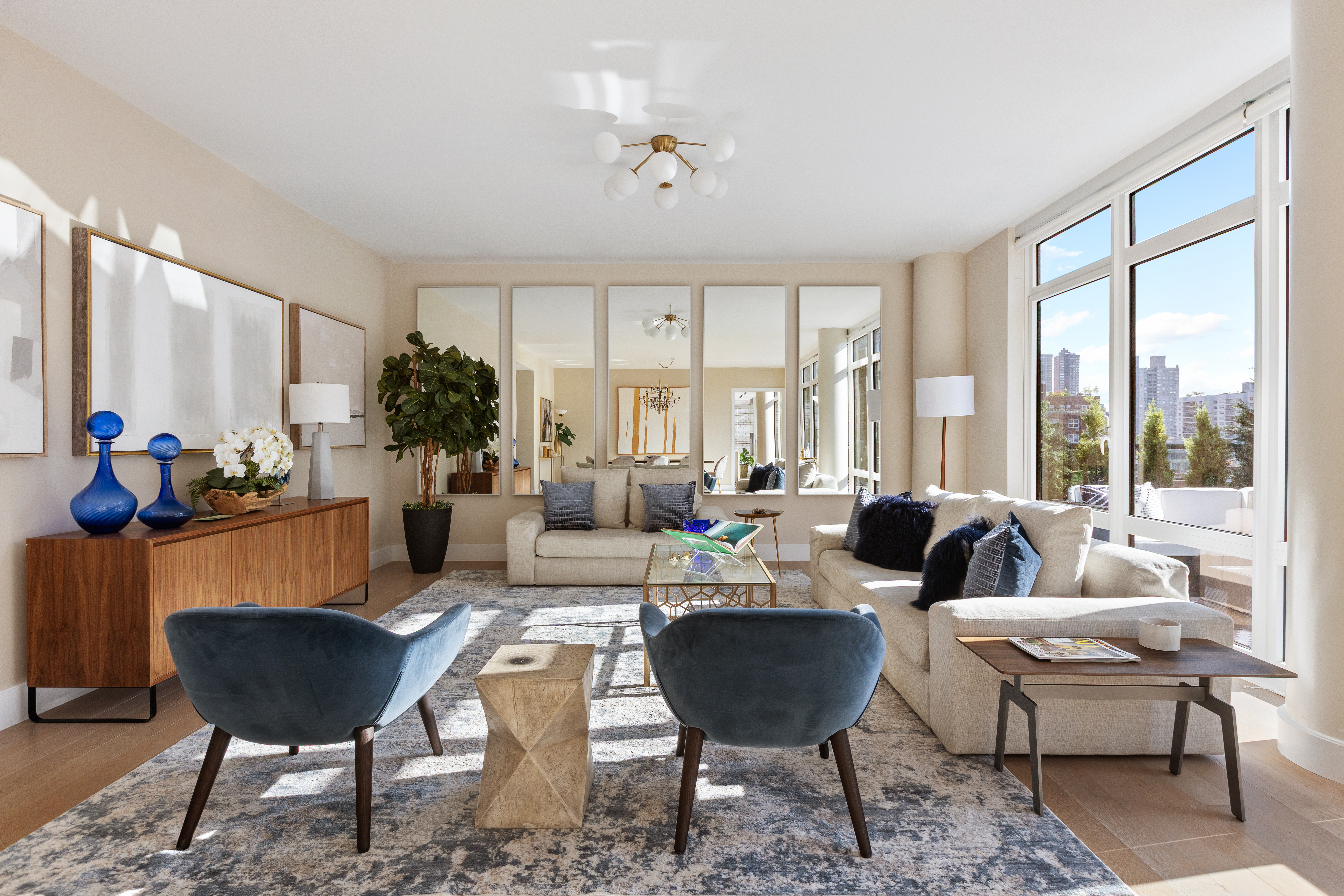 1355 1st Avenue, Unit 8 Manhattan, NY 10021 - Photo 3 of 25 a living room with furniture potted plant and a large window