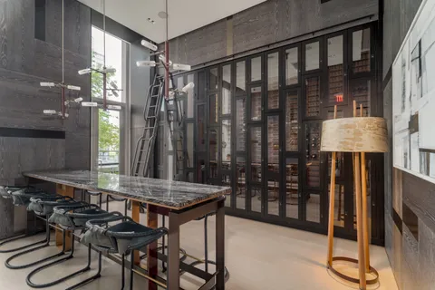 a kitchen with a table and chairs
