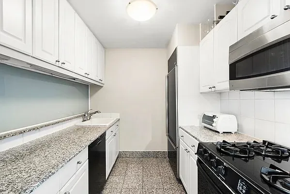 a kitchen with a stove and a sink