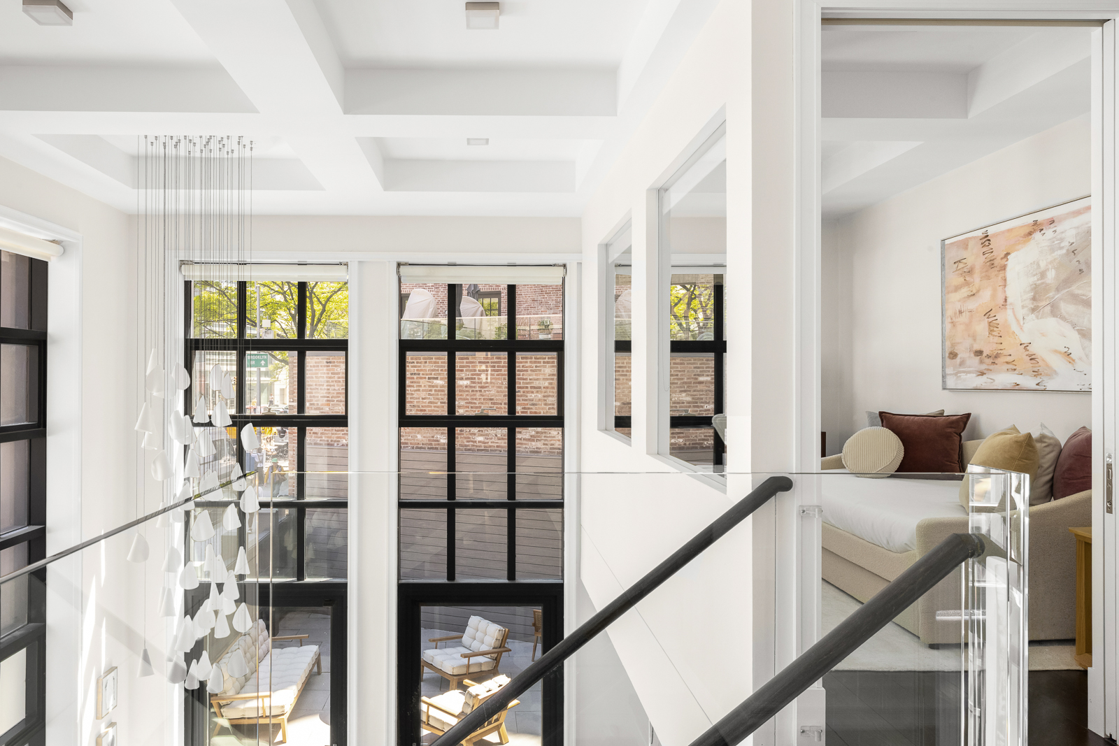 137 Franklin Street, Unit 1 Manhattan, NY 10013 - Photo 18 of 25 a view of a livingroom with furniture wooden floor and windows