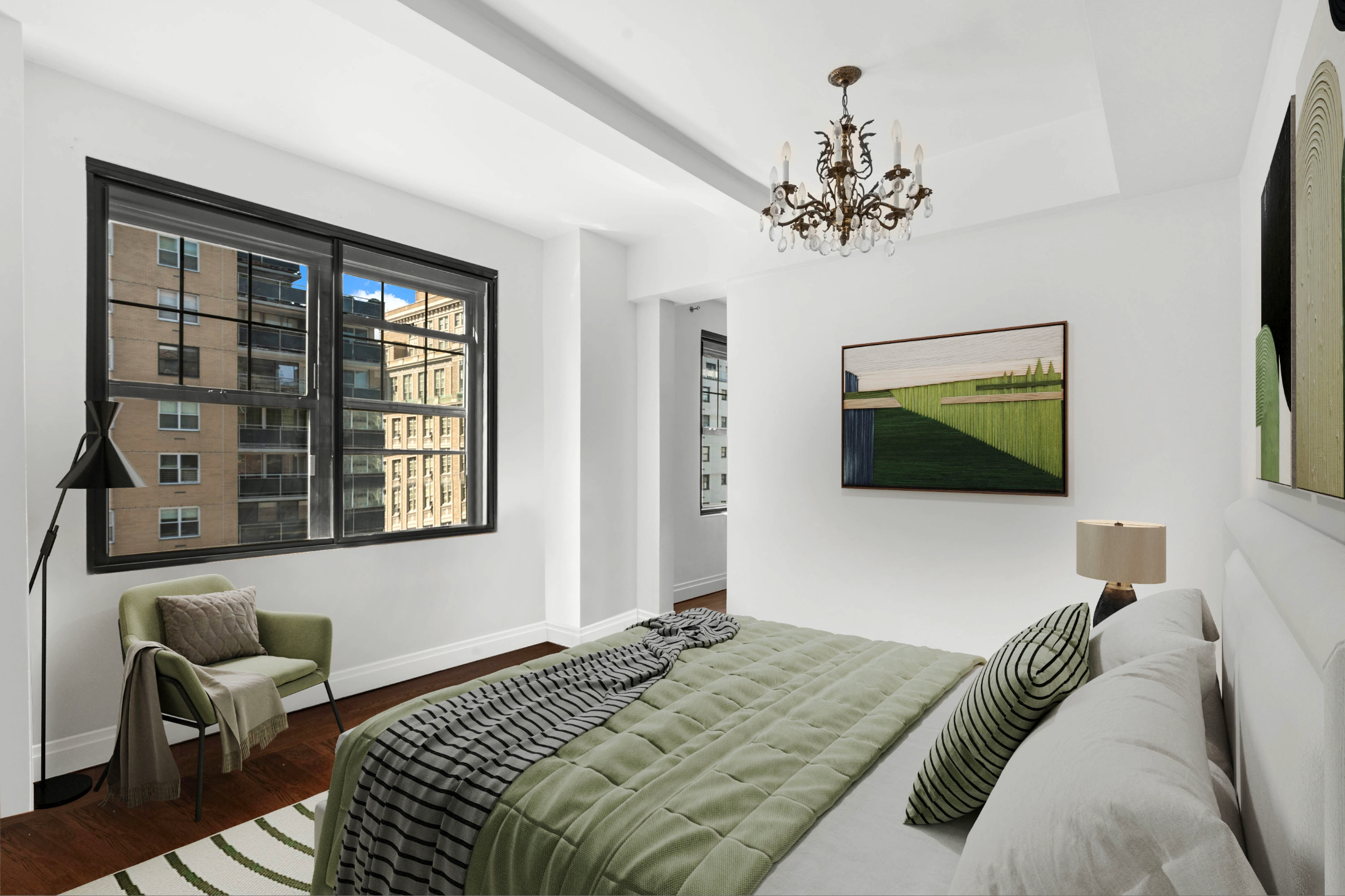 200 East 16th Street, Unit 14K Manhattan, NY 10003 - Photo 4 of 7 a bedroom with a bed and a flat screen tv