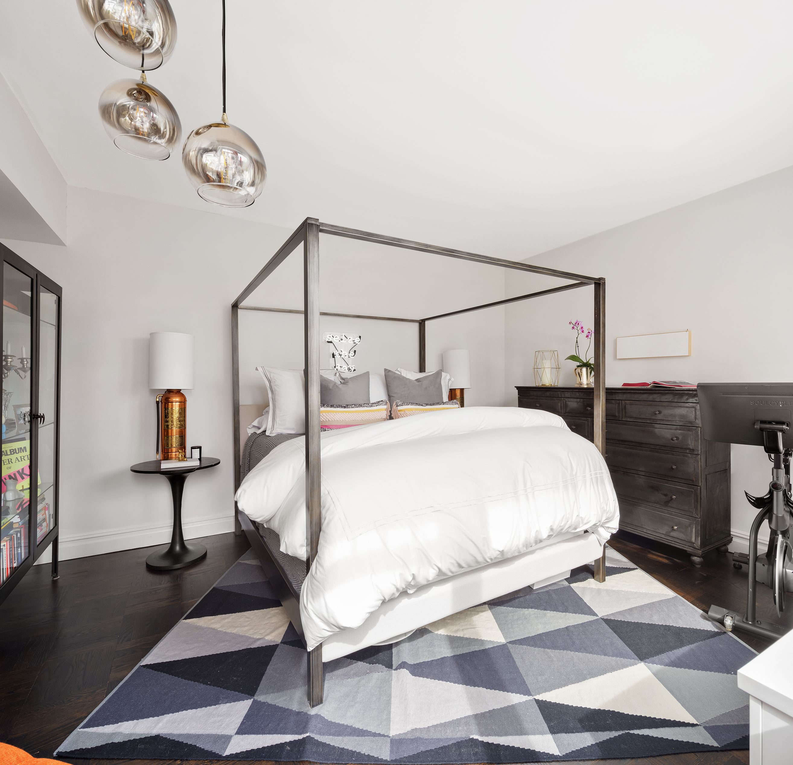 175 East 62nd Street, Unit PHA Manhattan, NY 10065 - Photo 10 of 18 a bedroom with a bed and a chandelier