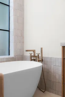 a bathroom with a granite countertop toilet a sink and a mirror