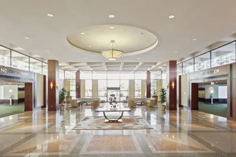 a view of a lobby with black carpet