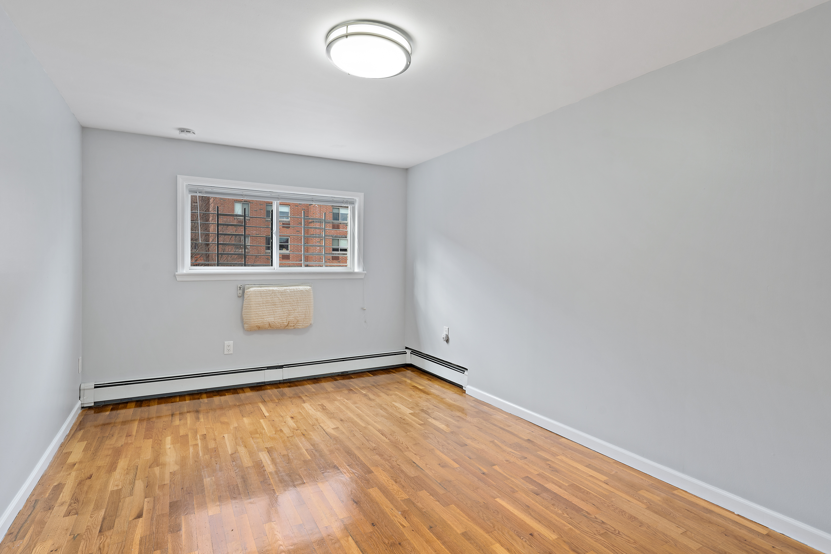 3230 Johnson Avenue, Unit 3 Bronx, NY 10463 - Photo 13 of 21 an empty room with a window