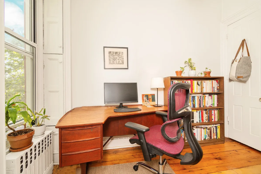 464 Macon Street, Unit 2 Brooklyn, NY 11233 - Photo 7 of 9 a bedroom with a bed and wooden floor