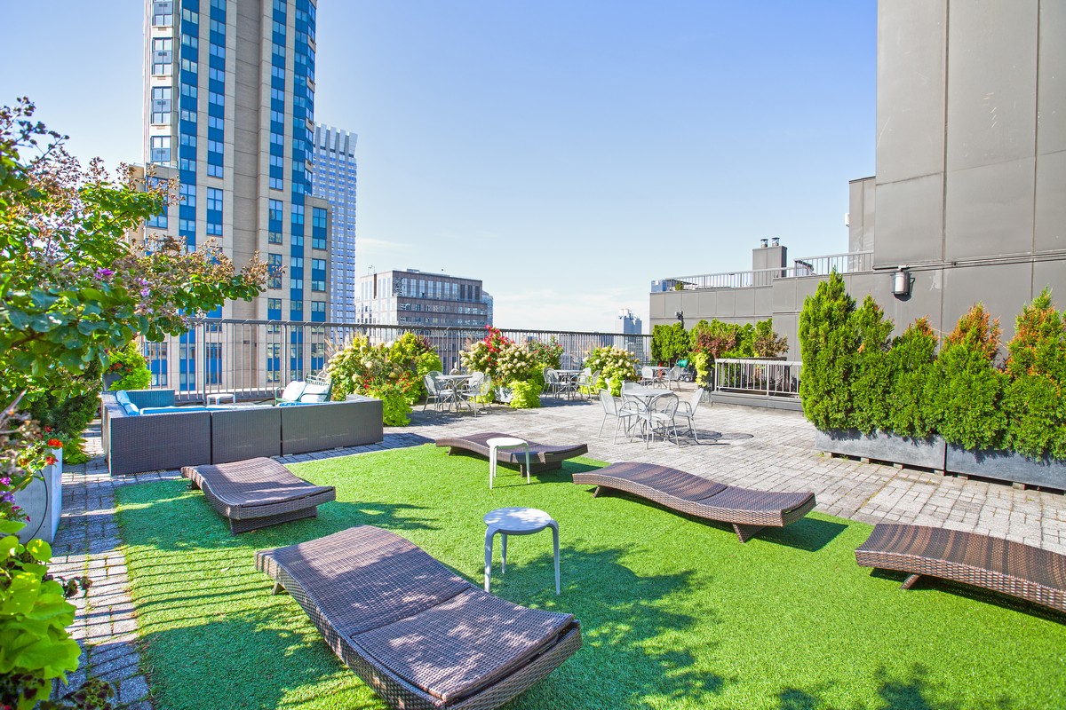 445 5th Avenue, Unit 23D Manhattan, NY 10016 - Photo 12 of 15 a view of backyard with outdoor seating and green space