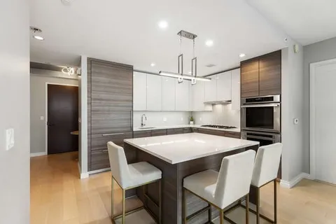 a kitchen with a table and chairs in it