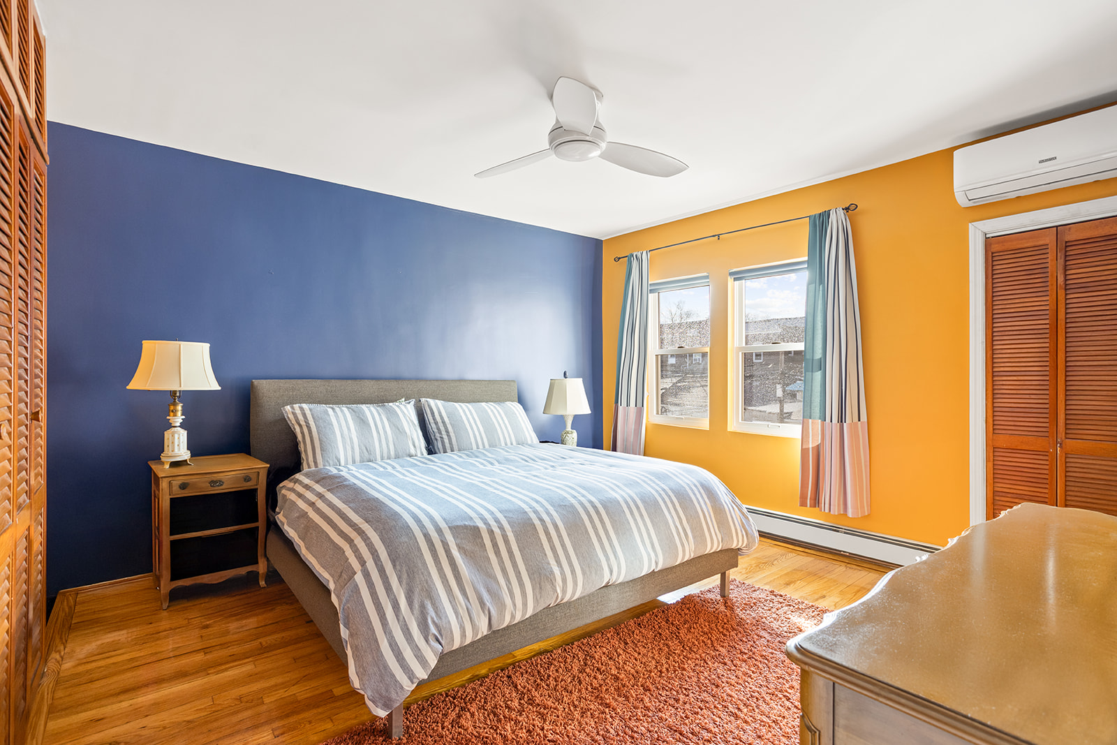 30-22 88th Street Queens, NY 11369 - Photo 6 of 14 a bedroom with a large bed and a large window