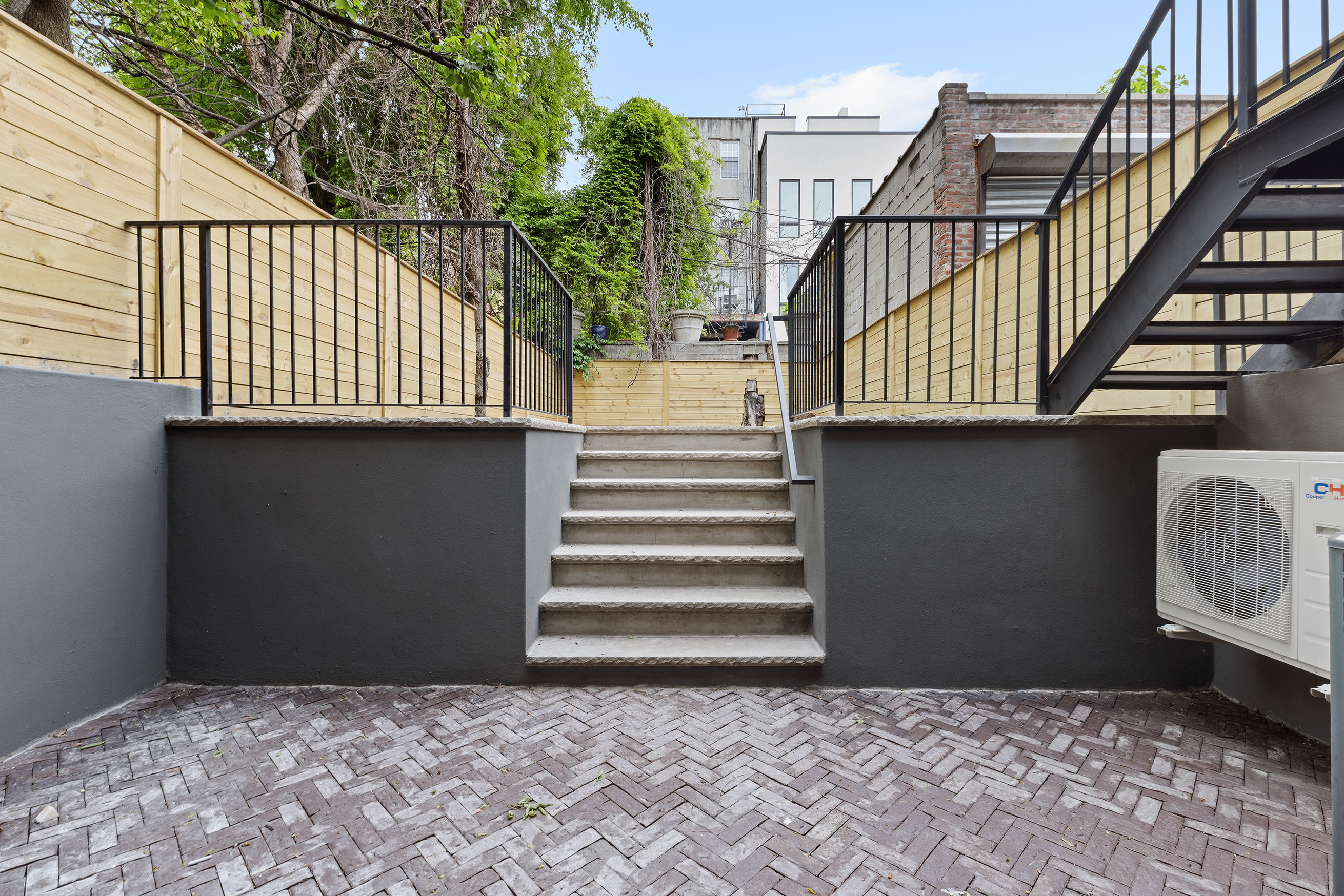 363 Warren Street Brooklyn, NY 11201 - Photo 18 of 23 a front view of a house with a gate