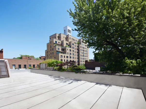 a view of a building with trees