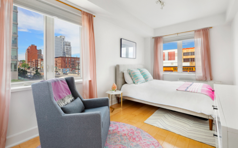 343 4th Avenue, Unit 2C Brooklyn, NY 11215 - Photo 3 of 12 a bedroom with a bed and glass window