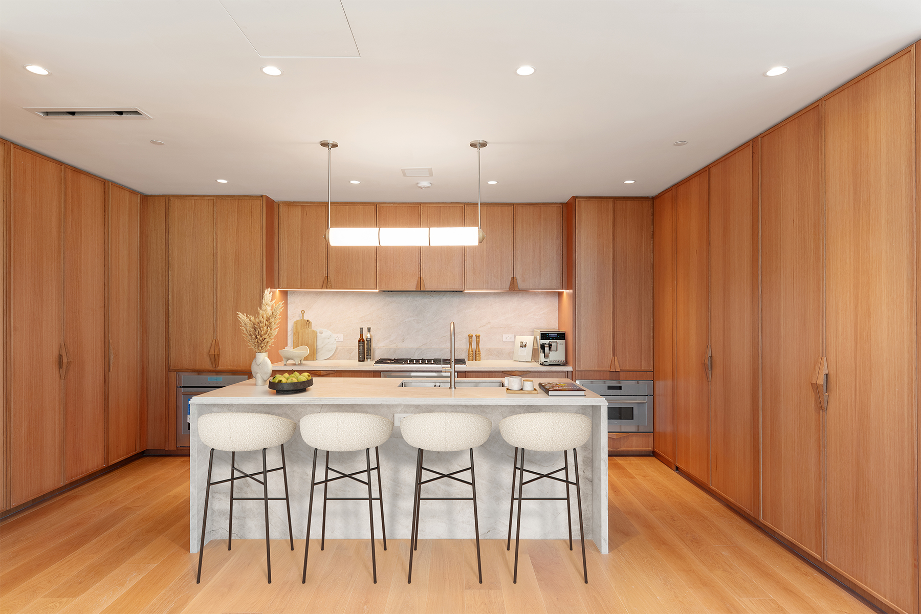 323 Bergen Street, Unit PH706E Brooklyn, NY 11217 - Photo 5 of 39 a kitchen with stainless steel appliances kitchen island granite countertop a table chairs sink and cabinets