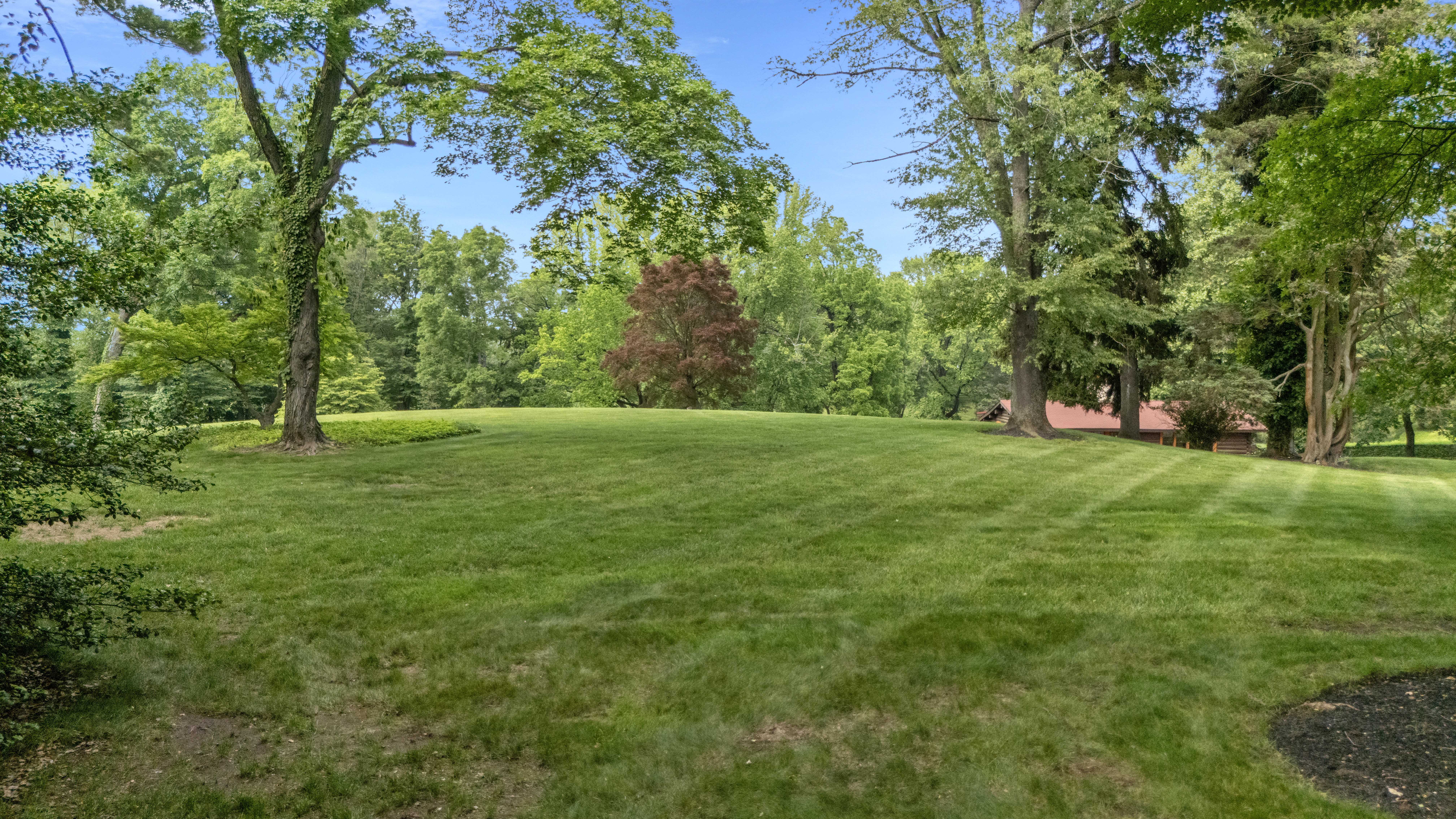 950 Stoke Road Villanova, PA 19085 - Photo 4 of 8 a view of green field with trees in the background