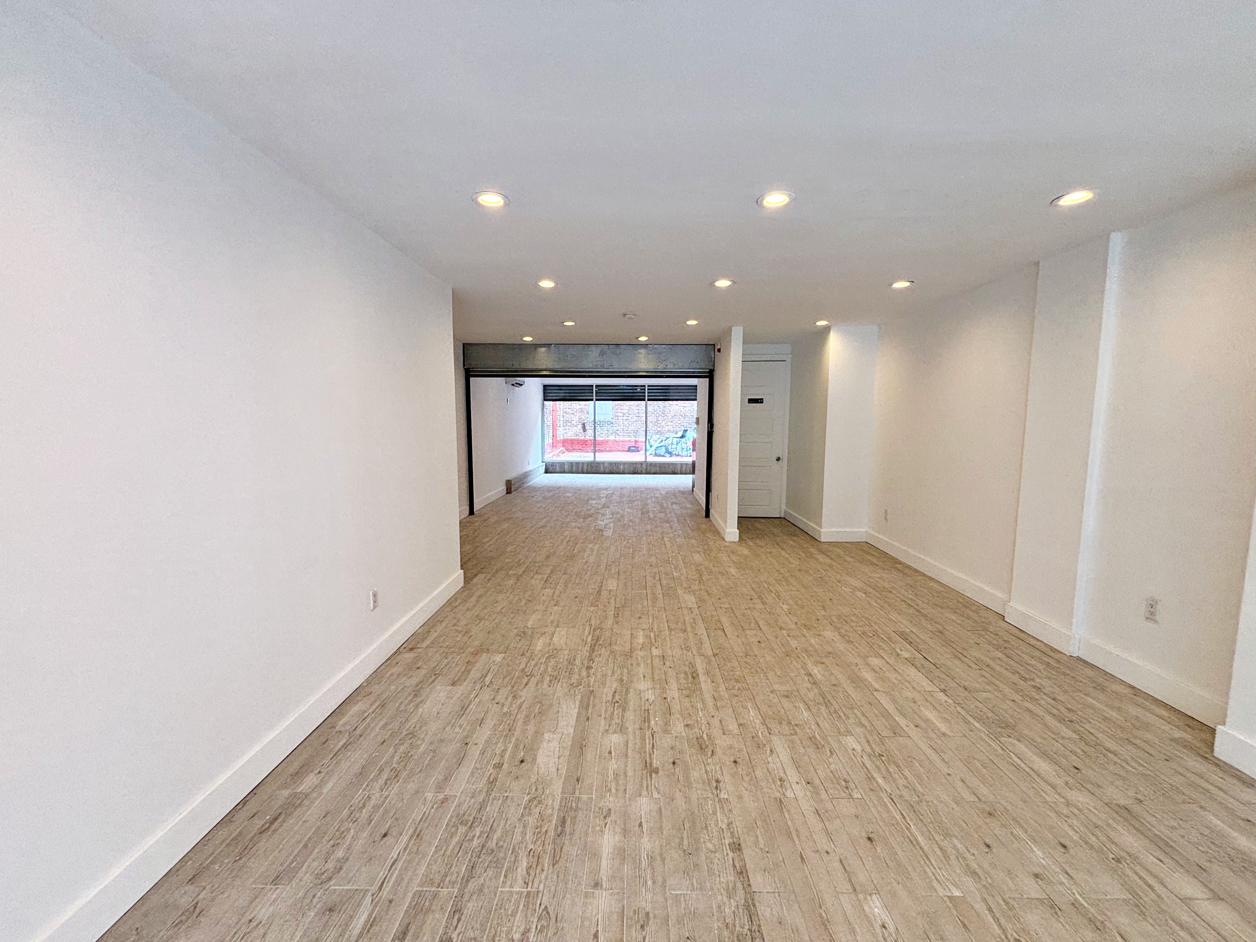 385 Nostrand Avenue, Unit Undisclosed Brooklyn, NY 11216 - Photo 3 of 27 a view of empty room with wooden floor