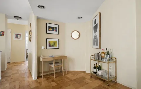 a room with storage and a table