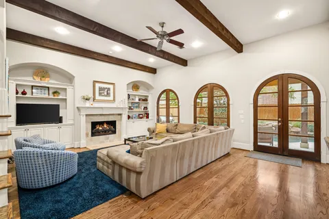 a living room with furniture fireplace and a flat screen tv