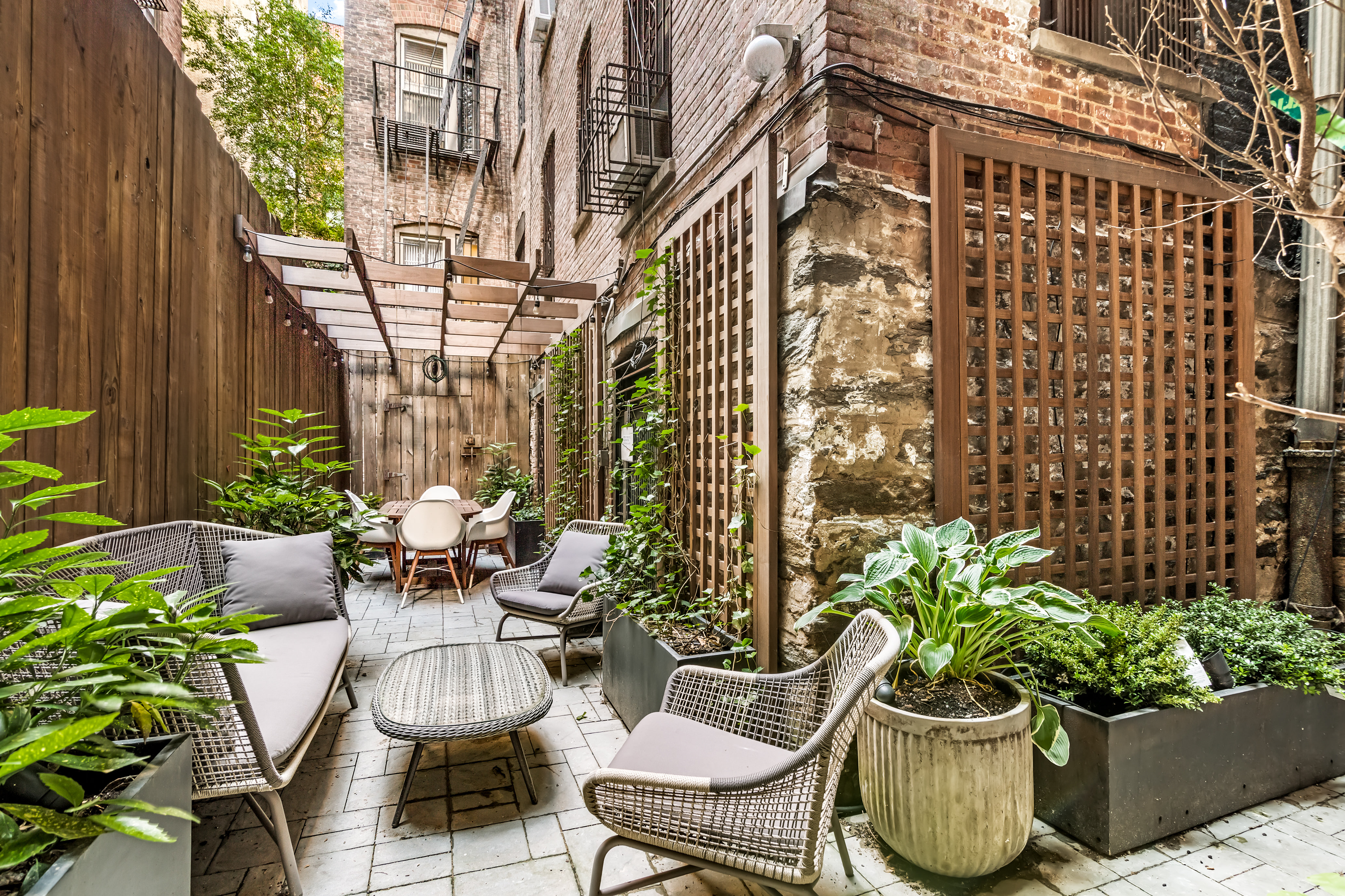 311 West 97th Street, Unit 1W Manhattan, NY 10025 - Photo 6 of 15 a view of a patio with plants and chairs