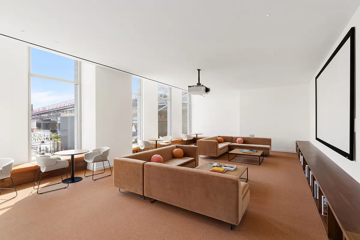 8 South 4th Street, Unit 15D Brooklyn, NY 11249 - Photo 23 of 29 a living room with furniture and a flat screen tv