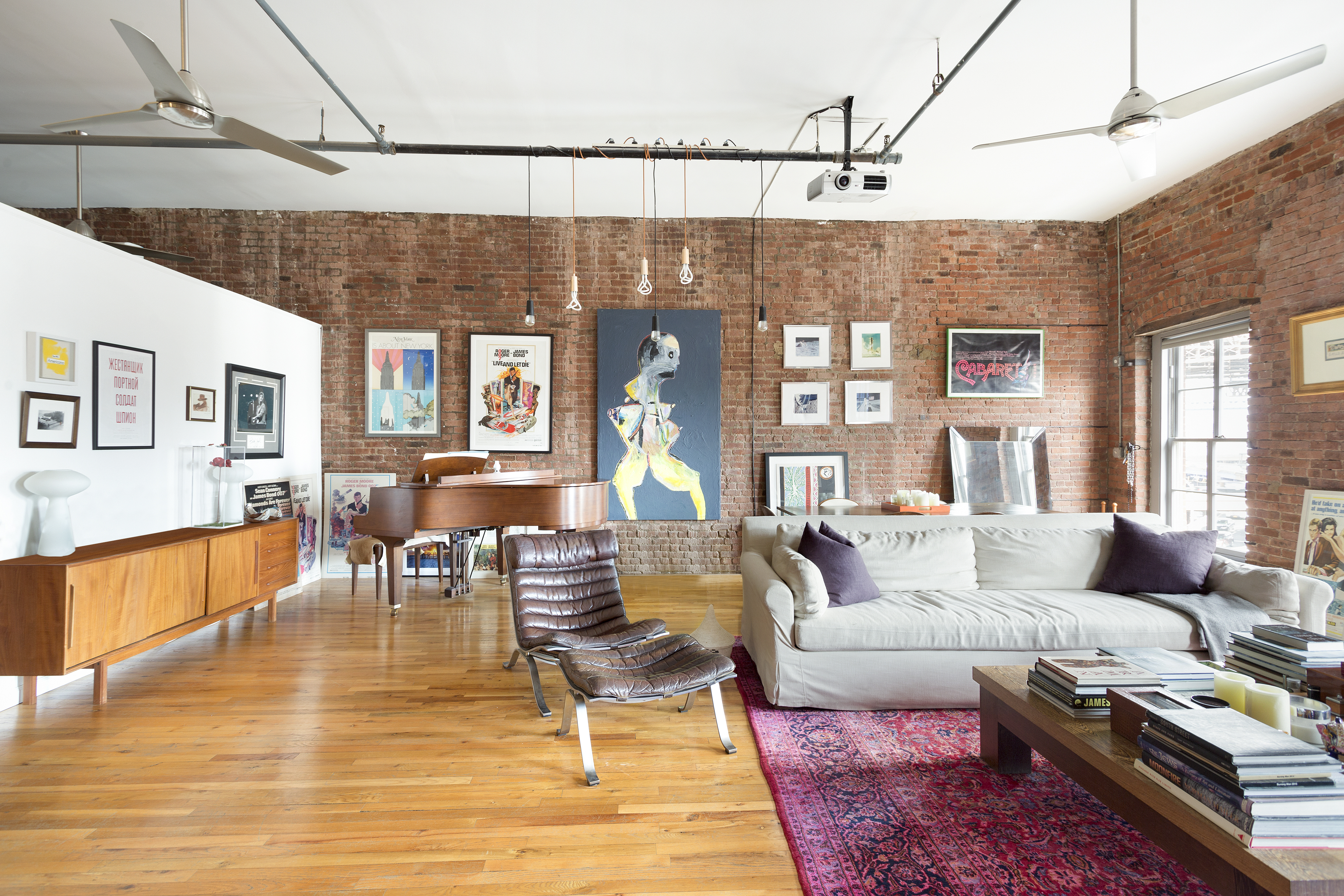272 Water Street, Unit 5F Manhattan, NY 10038 - Photo 2 of 12 a living room with furniture and wooden floor