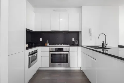 a kitchen with a stove and a microwave