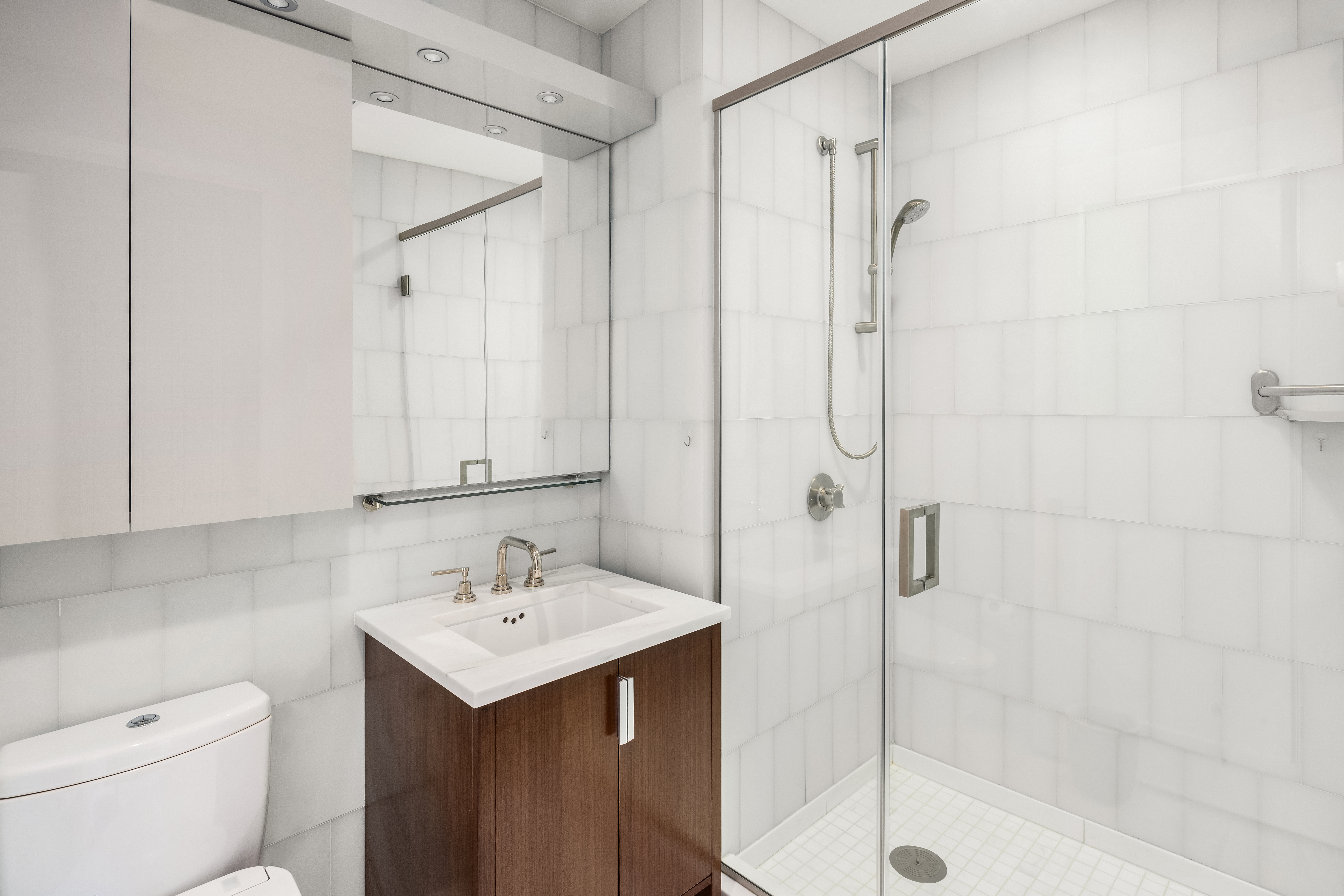 60 Riverside Boulevard, Unit PH4001 Manhattan, NY 10069 - Photo 9 of 33 a bathroom with a sink a toilet and shower