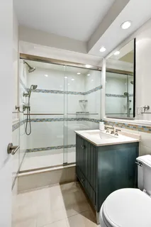a bathroom with a sink and mirror