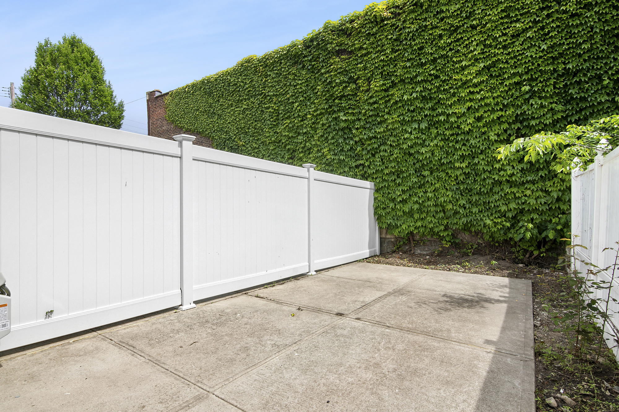 41-05 20th Avenue Queens, NY 11105 - Photo 13 of 20 a backyard of a house with lots of green space