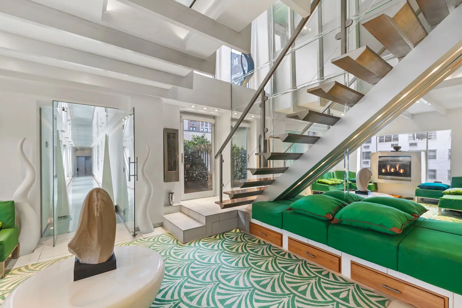 a living room with lots of furniture and a rug