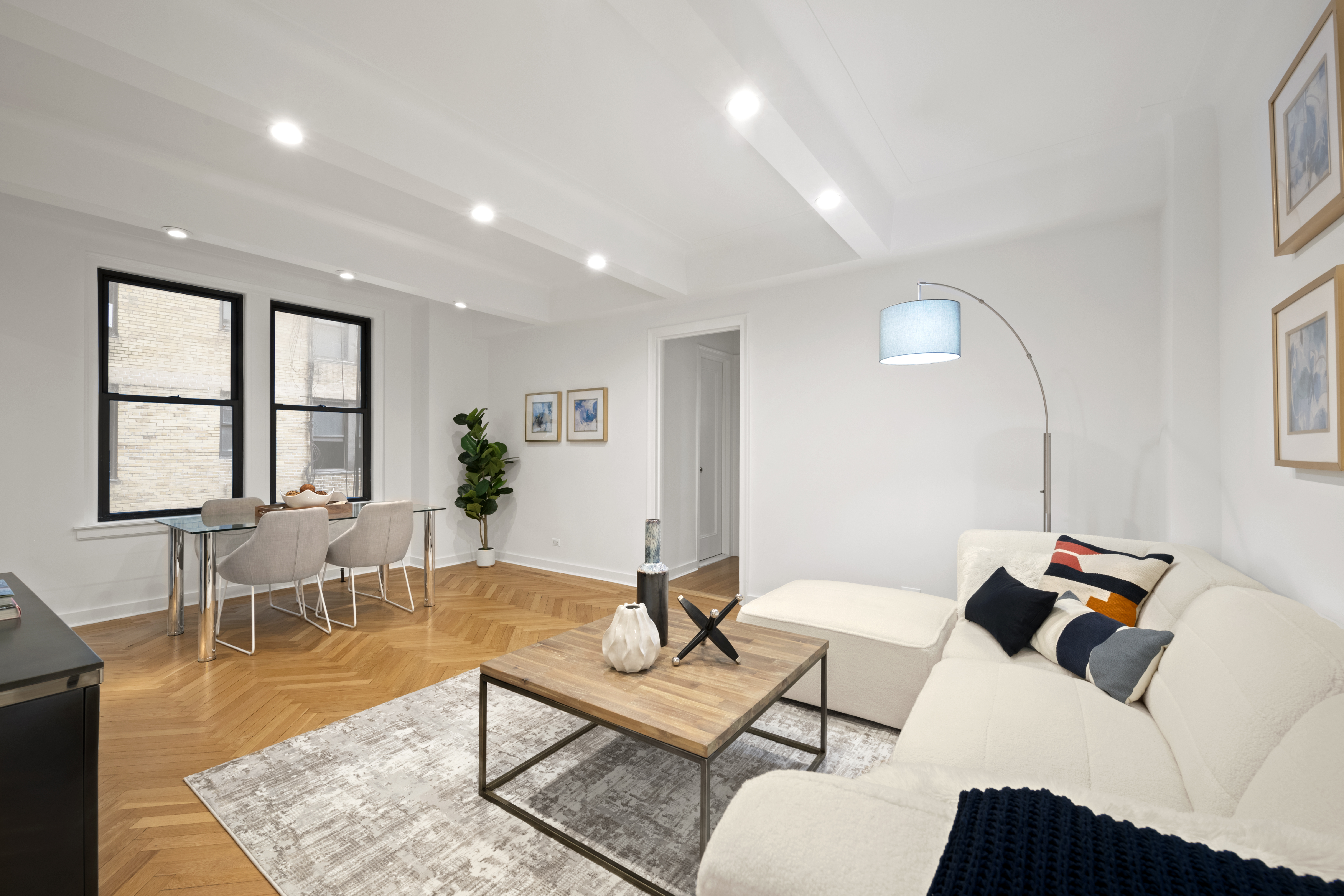 33 Riverside Drive, Unit 5D Manhattan, NY 10023 - Photo 1 of 7 a living room with furniture a window and a table