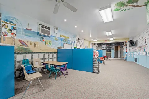 a dining room with furniture and a table