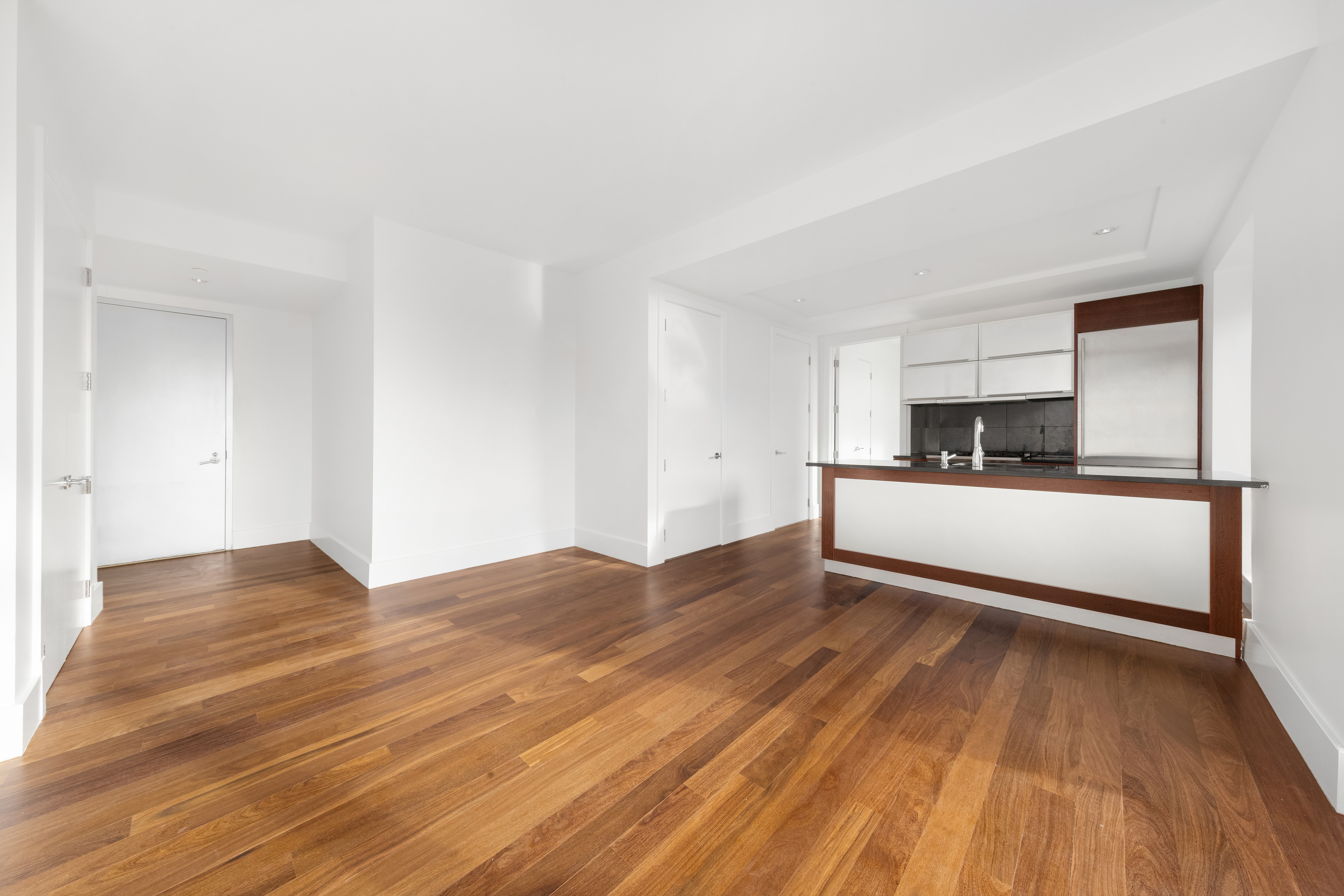 30 Bayard Street, Unit 4F Brooklyn, NY 11211 - Photo 3 of 12 a view of a kitchen with wooden floor and electronic appliances