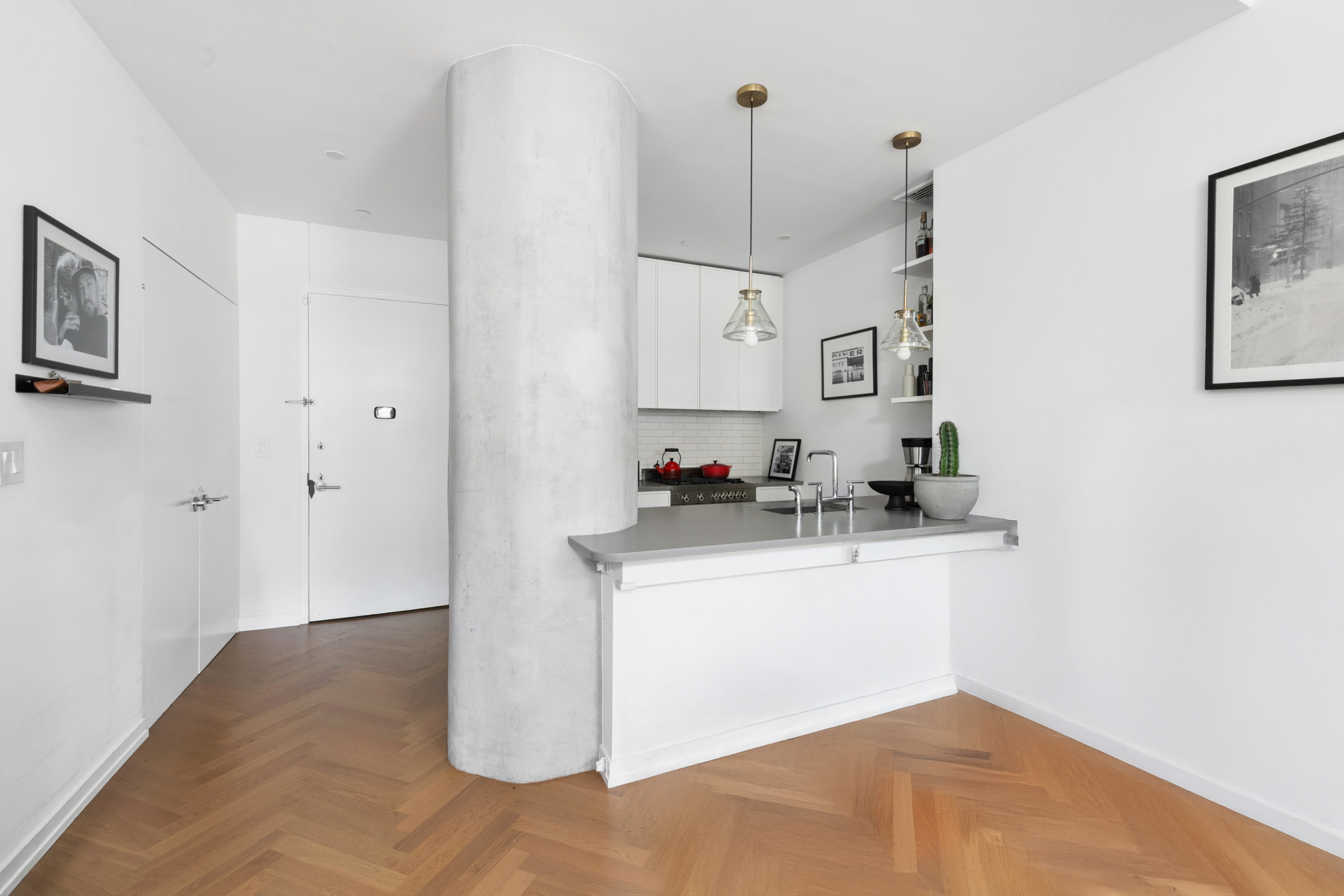 184 Kent Avenue, Unit D315 Brooklyn, NY 11249 - Photo 2 of 19 a kitchen with stainless steel appliances granite countertop a sink and a refrigerator