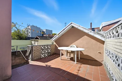 a view of a terrace with furniture