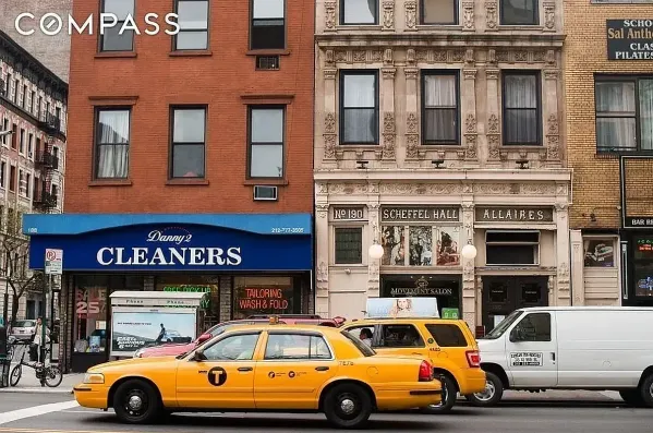a front view of a building with parking space