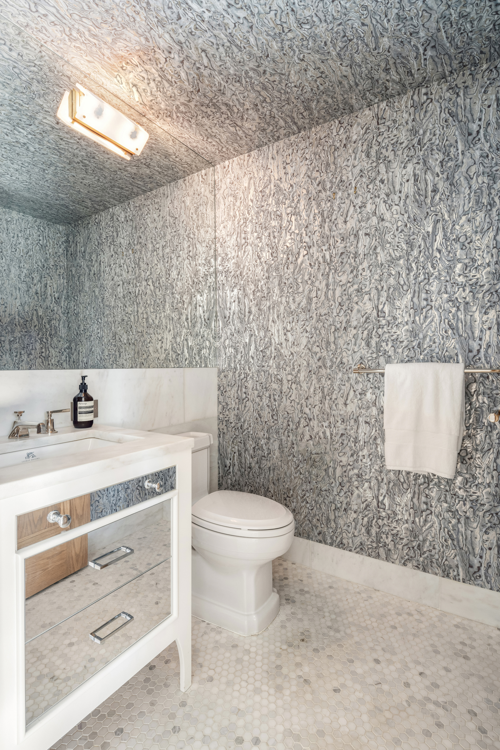 245 West 14th Street, Unit T3 Manhattan, NY 10011 - Photo 21 of 24 a bathroom with a toilet a sink and mirror