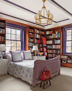 a living room with furniture a window and a chandelier