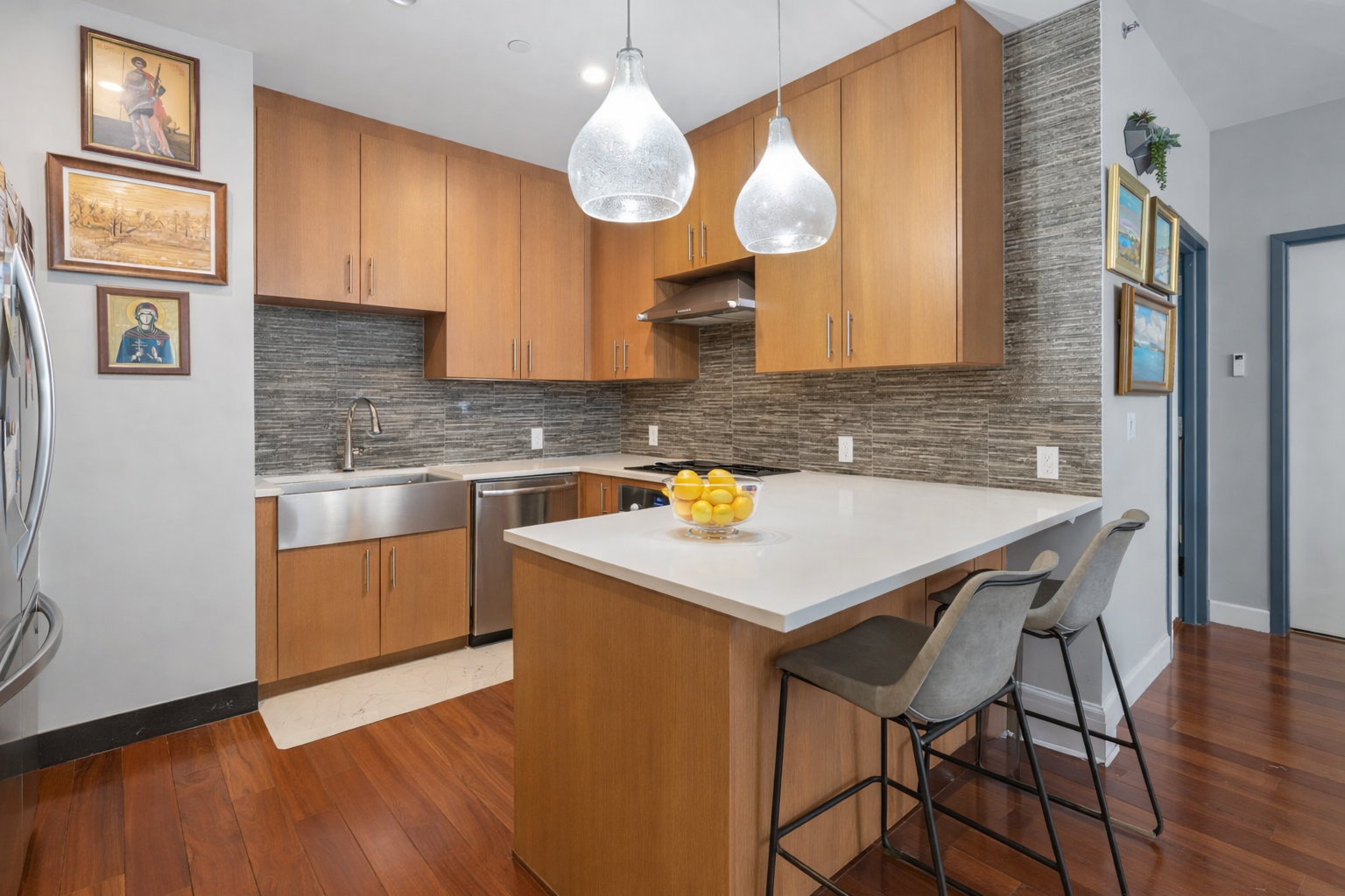 5-25 47th Road, Unit 2A Queens, NY 11101 - Photo 4 of 17 a kitchen with a table chairs sink and cabinets