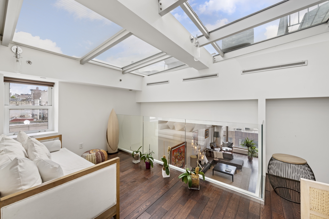 405 Broadway, Unit PH Manhattan, NY 10013 - Photo 7 of 17 a view of a workspace with furniture and a window