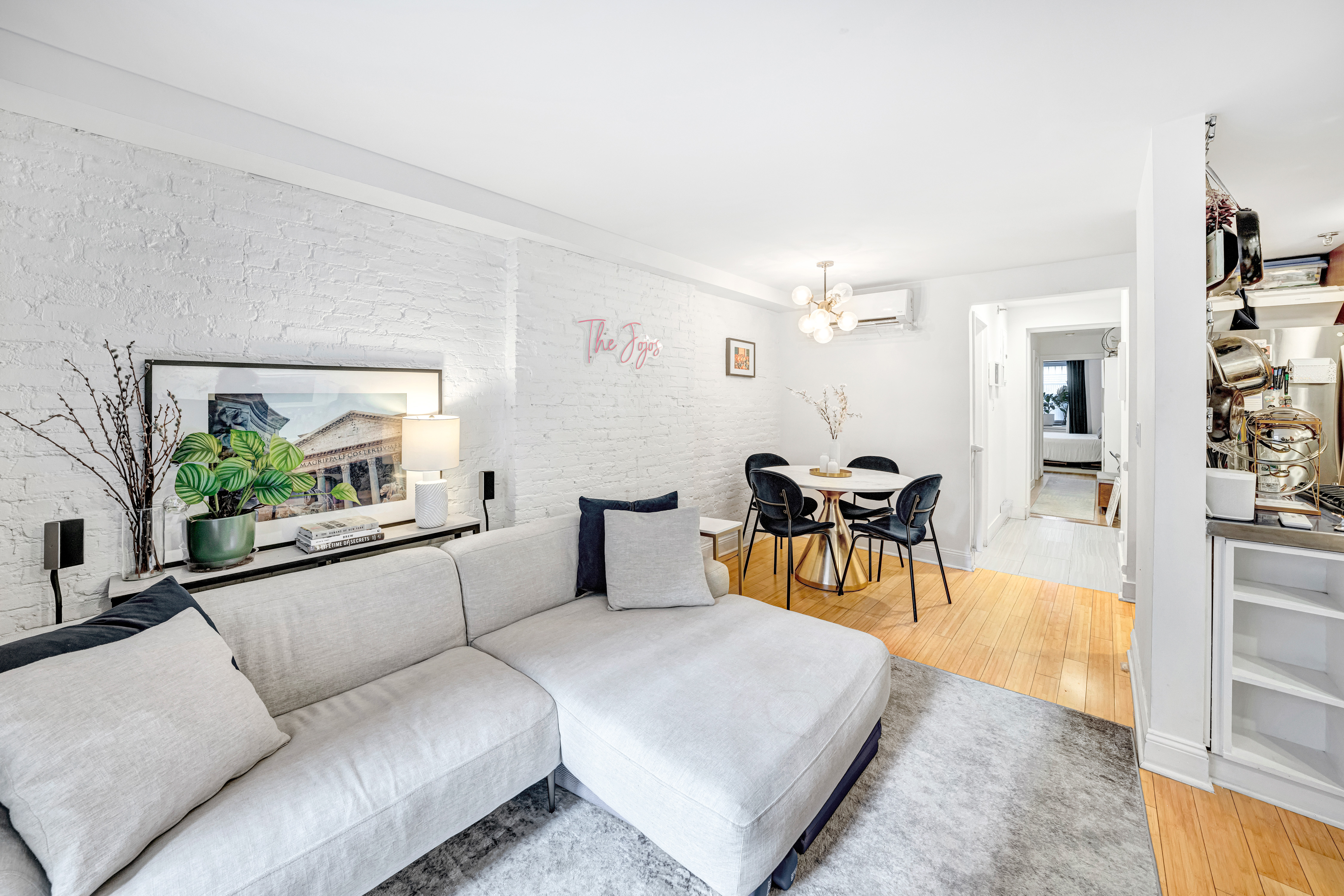 166 West 94th Street, Unit 1 Manhattan, NY 10025 - Photo 3 of 10 a living room with furniture and a table