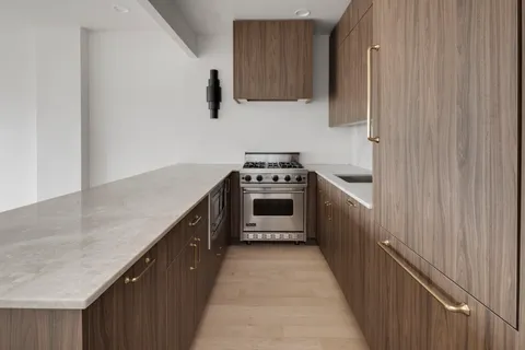a kitchen with a stove and a sink